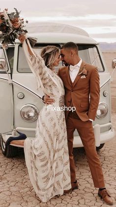 a bride and groom standing in front of an old vw bus