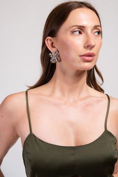 These stunning earrings feature intricate twist knot design with a gold/silver finish making them the perfect accessory for any occasion. With their medium size dangle design, they are both stylish and comfortable to wear. SizeLength: 1.5 in Width: 1.25 in QualityCrafted with high-quality environmentally friendly light, strong, metal alloy. Secures onto earlobe with a secure clip. ImportedECQM009 Metal Drop Flower Earrings For Evening, Metal Wrap Earrings With Ear Wire For Party, Metal Wrap Earrings For Party With Ear Wire, Metal Wrap Earrings For Party, Chic Silver Earrings For Summer, Chic Silver Wrap Earrings For Party, Metal Wrap Drop Earrings For Party, Vacation Earrings, Pearl Shop