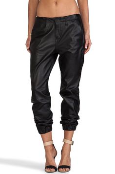 100% AUTHENTIC NEW WITH TAG WOMEN'S RAG & BONE PANTS "PAJAMA JEAN" SIZE:28x28 APPROXIMATE MEASUREMENTS (LAYING FLAT): WAIST: 17.5" RISE: 11" LEG OPENING: 4.5" DETAILS: **PLEASE NOTE:THERE ARE A FEW STAINS ON BOTH FRONT PANT LEGS AROUND THE KNEE AREA WHICH IS SHOWN IN THE PICTURES.  PLEASE VIEW ALL PICTURES AND ASK ANY QUESTIONS BEFORE YOU COMMIT TO PURCHASING THIS ITEM. THANKS!** COLOR:BLACK LEATHER STYLE:W1609L008 TWO FRONT SLANT POCKETS BACK FAUX POCKETS ZIPPER FLY WITH CLASP BUTTON CLOSURE LO Silk Joggers, Unisex Pajamas, Pajama Pant, Pj Pants, Black Trousers, Leather Trousers, Wool Pants, Revolve Clothing, Jogger Jeans