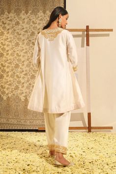 Ivory chauga kurta with floral, paisley embroidery using gota patti, dabka, zardozi work. Paired with a salwar. - Aza Fashions Elegant Cream Palazzo Set For Reception, Beige Raw Silk Sets With Dabka Details, Beige Raw Silk Dabka Sets, Beige Dabka Raw Silk Set, Cream Straight Kurta Set For Wedding, Elegant Designer Cream Palazzo Set, Elegant Cream Designer Palazzo Set, Elegant Off White Palazzo Set For Designer Wear, Elegant Cotton Silk Sets For Reception