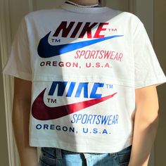 From The Nike Headquarters Nike Retro T-shirt With Letter Print, Retro Nike T-shirt With Letter Print, White Cropped T-shirt With Logo Print For Spring, Spring White Cropped T-shirt With Logo, Sporty Logo Print Cropped T-shirt For Spring, Vintage Nike Cotton Tops, Retro Spring Tops With Logo Print, Spring Retro Tops With Logo Print, Nike Text Print Top For Streetwear