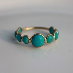 > Material - 18K Solid Yellow Gold > Gemstone - Genuine Turquoise > Gemstone Shape - Cabochons > Stone weight -1.70 ct > Gross weight - 1.3 grams This ring is made to order, so it may take 3-5 days for it to be ready, after the payment is made. Turquoise is perhaps the oldest stone in man's history, the talisman of kings, shamans, and warriors. It is a stone of protection, strong and opaque, yet soothing to the touch, healing to the eye, as if carved from an azure heaven and slipp Turquoise Multi-stone Round Opal Ring, Turquoise Opal Ring In 14k Gold, Turquoise Round Opal Ring In 14k Gold, Turquoise 14k Gold Round Opal Ring, Round Turquoise Gemstone Ring In 14k Gold, 14k Gold Turquoise Gemstone Ring, Elegant Turquoise Ring With Bezel Setting For Anniversary, Elegant Turquoise Ring For Anniversary With Round Band, Elegant Turquoise Ring With Round Band For Anniversary