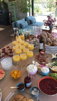 a table filled with lots of food and drinks