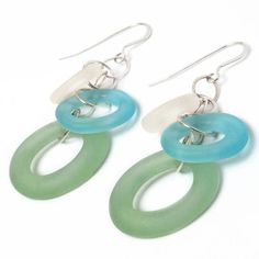 two green and white earrings with silver hooks