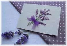 a small card with purple flowers on it