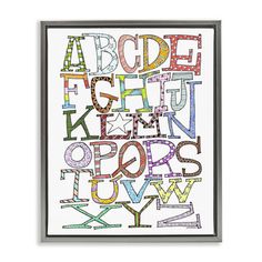 an art print with colorful letters and numbers on the front, in black frame against a white background