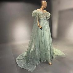 Dubai-Inspired Elegance: Embrace the elegance and opulence of Dubai with a gown that captures the city's rich culture and luxury, making it the epitome of Arabic grace for weddings and formal soirees. Mint Green Beauty: The mint green color brings an element of freshness and grace to your look, ensuring you stand out with timeless elegance. Feathered Cape Sleeve: The gown features a feathered cape sleeve that adds a sense of drama and flair, creating a captivating and memorable appearance as you Feather Cape, Luxurious Wedding, Red Carpet Gowns, Dress Drawing, Evening Dress Fashion, Full Dress, Cape Sleeves, Formal Dresses For Women, Sequin Beading