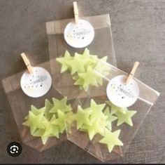 some yellow stars are sitting on top of clear bags