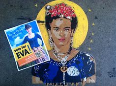 an image of frida on the side of a building with a book in front of it