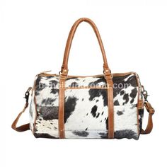 Experience luxury on the go with our stylish black and white cowhide duffle bag. Versatile for long haul travel, gym visits, mommy essentials, and more! - Free shipping all our cowhide duffle bags. - Size - 22" Inch ( Length ) x 10" Inch ( Width ) x 11" Inch Height. - Detachable Shoulder Strap approx 40" long. Handle drop (from the middle) = 8" (Perfect to hold it or carry on shoulders) - All duffels are lined and have zipper pockets inside. - Double Stitched Seams - Thick Stitching - Reinforced Leather Duffel Bag, Leather Weekender Bag, Leather Duffel, Cowhide Bag, Leather Weekender, On The Plane, Cow Skin, Overnight Bag, Duffel Bag