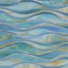 an artistic glass tile design with wavy waves