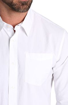 Refresh your essentials with this solid classic fit button-up shirt constructed from crisp, lightweight cotton. Front button closure Point collar Long sleeves with button cuffs Chest patch pocket 100% cotton Dry clean or machine wash, tumble dry Imported Relaxed Fit Cotton Dress Shirt With Button Closure, Everyday Cotton Dress Shirt With Button Closure, Solid Shirt With Button Cuffs For Everyday Wear, Cotton Dress Shirt For Everyday, White Cotton Dress Shirt For Everyday, Everyday White Cotton Dress Shirt, Casual Dress Shirt With Spread Collar For Everyday, Casual Button-up Dress Shirt, Casual Button-up Dress Shirt For Everyday