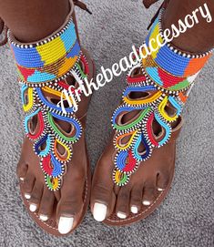 Beautifully designed African beaded sandals, Masai sandals, summer sandals, African sandals Made from fine leather and very fine beads. Available in all sizes. Kindly, using the chart provided in the pictures above, check your foot size in EUR and US sizes before placing your order. Wholesale is available upon request at a discount price. Shipping is via DHL EXPRESS with a GUARANTEED delivery between 3-5 days worldwide. **BUY MULTIPLE ITEMS, PAY SHIPPING ONCE** FREE SHIPPING FOR ALL ADDITIONAL I Luxury Multicolor Sandals For Summer, Cheap Multicolor Sandals For Vacation, Cheap Adjustable Sandals For Festivals, Cheap Multicolor Leather Sandals, Cheap Multicolor Beaded Sandals, Cheap Beaded Sandals For Summer, Luxury Multicolor Casual Sandals, Affordable Beaded Sandals For Spring, Luxury Multicolor Sandals For Vacation