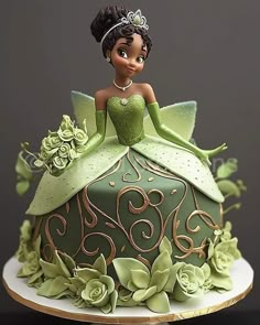 there is a cake decorated with a princess and the frog on it's side