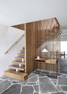 the stairs are made out of wood and have been designed to look like wooden slats