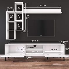 the measurements for a tv stand and entertainment center in an empty room with dark walls