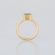 This unique piece showcasing a 2.17-carat emerald set in 18K yellow gold. Emeralds, among the oldest known gemstones, were beloved by Queen Cleopatra. Every stone is carefully handpicked by Satomi for its distinctive beauty and scarcity. Every piece is expertly crafted in our NYC studio, making our designs truly special. Please note that this ring can only be resized ±2 sizes from its original size. Modern Yellow Gold Emerald Ring For May Birthstone, Modern Yellow Gold Emerald Ring, Modern Tsavorite Emerald Ring As Gift, Gold Tsavorite Emerald Ring For Formal Occasions, Classic Gold Ring With Tsavorite, Formal Gold Emerald Ring With Tsavorite, Tsavorite Emerald Ring In Yellow Gold For Gift, Yellow Gold Tsavorite Emerald Ring As Gift, Tsavorite Emerald Ring In Yellow Gold As A Gift