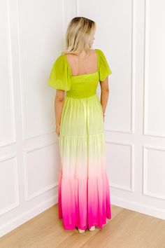 - Steal the show with this vibrant dress! - Fully lined chiffon material with a colorful ombre design - A sweetheart neckline that goes into a twist detail at the bodice - A cut out detail below the bust - A smocked back - A flowy silhouette that ends in a maxi length hemline Green Color Block Dress For Vacation, Green Color Block Vacation Dress, Fitted Ombre Maxi Dress For Summer, Ombre Dress For Spring Vacation, Summer Ombre Fitted Dresses, Fitted Ombre Summer Dress, Fitted Ombre Dress For Summer, Fitted Gradient Dress For Summer, Fitted Ombre Maxi Dress For Spring