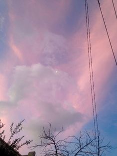 the sky is pink and blue with some clouds