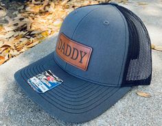 Daddy leather patch hat Richardson 112 Snapback hat and Yupoong Snapback Hats 100% Full Grain Laser Engraved Leather Patch Hat This is not the fake leather that you see on some of the cheaper hats, we hand stain each piece of leather Father's Day Snapback Hat With Leather Patch, Brown Curved Brim Trucker Hat For Father's Day, Father's Day Flat Bill Hat With Leather Patch, Leather Patch Cap - Gift, Leather Patch Cap As A Gift, Leather Patch Cap Hat Gift, Leather Patch Cap As Gift, Black Trucker Hat For Father's Day Gift, Brown Trucker Hat For Father's Day Outdoor