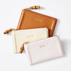 For credit cards, business cards, a bit of cash or any small, precious items, the Emily zip case is made from gorgeous pebbled leather, with a genuine bamboo zipper pull and an unexpected, but classic, striped lining. A perfect gift for birthdays or life milestones, add a foil debossed monogram for a personal touch.  5"w x 3"h  Pebbled leather, bamboo, striped lining (92% polyester, 8% cotton 8%)  Clean with a dry cloth.  Imported.  Monogramming is foil debossed. Modern Card Holder With Zipper Closure As Gift, Classic Rfid Blocking Coin Purse Gift, Classic Zipper Coin Purse For Gift, Classic Coin Purse With Zipper As Gift, Classic Zipper Coin Purse As Gift, Modern Rfid Blocking Coin Purse As Gift, Compact Rfid Blocking Coin Purse As Gift, Compact Rfid-blocking Coin Purse Gift, Rectangular Zipper Pouch Card Holder Gift