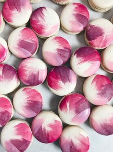 pink and white macaroni shells on a table