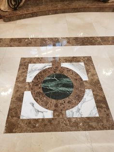 a marble floor with a circular design on it