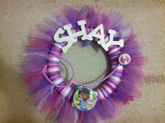 a purple and pink tulle wreath with the word sale on it