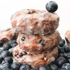 three blueberry donuts stacked on top of each other