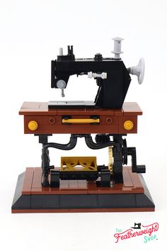 a toy sewing machine is shown on a white background with words below it that read,