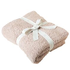 two towels wrapped in pink and white with a bow