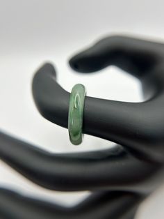 This natural grade A Burma Jadeite ring is  green and white. with inner size 18.02mm, thick:2.86, height:9.27 out size:4.91. All of our jewelry pieces are guarantee to be grade A. meaning they are not treated with chemicals and not dyed. they are 100% natural jadeite from Burma. Color of the Jade might be different due to screen resolution and screen settings. If you want to see the product before buying please contact us, and we can set up a video call to show the product. Green Jade Round Band Jewelry, Green Jade Round Band Ring, Classic Green Round Band Ring, Classic Green Jade Rings, Green Jade Ring For Gift, Green Jade Ring As A Gift, Green Jade Ring Suitable For Gift, Green Gemstone Ring With Round Band, Jadeite Ring