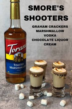 there are marshmallows next to some shots