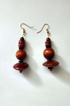 Vintage wooden bead earrings.   All earrings were created by artisan Jim Wright of Tempe AZ in the 80's and 90's.  Jim was an engineer whose skills included welding, metal and wood working, lost wax casting, enameling, drawing, painting and photo processing.  Jim's skills were enhanced when he began working with Bob Winston, a modernist jeweler, whose work is in the Smithsonian. More pictures can be provided upon request. Vintage Brown Round Bead Earrings, Adjustable Brown Earrings With Wooden Beads, Brown Wooden Bead Earrings, Brown Wooden Bead Drop Earrings, Unique Brown Wooden Beads Earrings, Unique Brown Earrings With Wooden Beads, Brown Wooden Earrings For Pierced Ears, Unique Natural Wood Earrings, Wooden Beads Drop Earrings