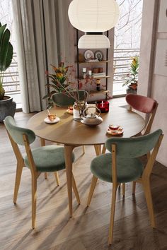 a wooden table with four chairs around it in front of a window and potted plants