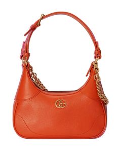 small Aphrodite shoulder bag from Gucci featuring pumpkin orange, leather, signature Interlocking G logo plaque, gold-tone hardware, top zip fastening, single flat top handle, adjustable detachable shoulder strap, detachable chain-link shoulder strap and main compartment. This item is in size UNI and the color is Orange Gucci Orange, Chain Strap Bag, Round Bag, Shoulder Chain, Orange Bag, Orange Leather, Small Shoulder Bag, Womens Purses, Chain Shoulder Bag