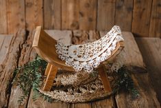 a wooden chair sitting on top of a wooden floor