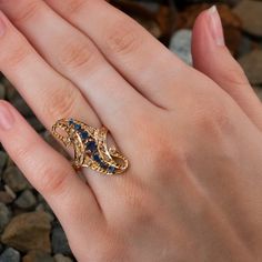 This pretty antique ring features sapphires and diamonds and is crafted of 10k yellow gold. The ring has middle eastern stamps. Some of the sapphires have chips/abrasions and the center sapphire shows some damage but appears stable. This ring is currently a size 8.75. Heirloom Sapphire Diamond Ring With Multi-stone, Antique Sapphire Jewelry With Single Cut Diamonds, Gold Sapphire Diamond Multi-stone Ring, Gold Multi-stone Sapphire Ring With Diamonds, Gold Sapphire Ring With Multi-stone Diamonds, Victorian Multi-stone Yellow Gold Diamond Ring, Antique Sapphire Ring With 17 Jewels, Art Deco Gold Sapphire Jewelry, Antique Multi-stone Gold Diamond Ring