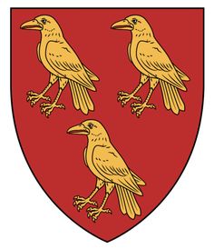 three yellow birds sitting on top of a red shield