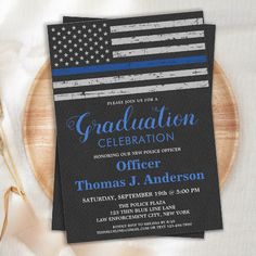 an american flag and blue line graduation party card on a wooden platter with utensils