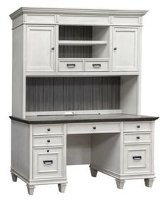 a white desk with drawers and cupboards