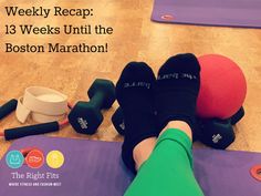 a person laying on top of a yoga mat with dumbbells and exercise balls