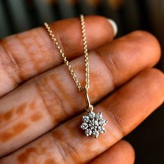 "A pretty 9 diamond flower charm pendant, handcrafted in 14k gold with a dainty cable chain, this feminine necklace is versatile and a perfect everyday jewelry piece! * Flower Size : 8 mm * Gemstone : Natural Diamond * Diamond Wt : 0.31 ct * Color / Clarity : H-I, Vs-Si * Gold - 14K Solid Gold If you like this necklace, please press \"Pin it\" button on the top of your screen. Follow us on Instagram : @abhikajewels Like us on Facebook: www.facebook.com/Abhikajewels Thank you for visiting our sho Diamond Jewelry With Flower Charm, White Gold Diamond Necklace With Flower Pendant, Dainty Diamond Jewelry With Flower Charm, Yellow Gold Sterling Silver Diamond Necklace With Flower Pendant, Diamond Pendant With Flower Charm, Dainty Jewelry With Brilliant Cut Flower Pendant, Flower Shaped Necklace With Single Cut Diamonds For Gift, 14k Gold Diamond Flower Pendant Necklace, Fine Jewelry: 14k Gold Diamond Necklace With Flower Pendant