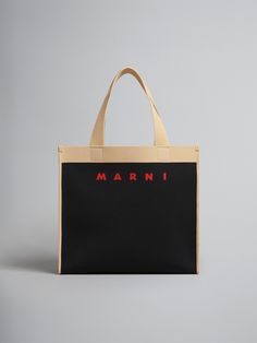 Shopping bag in knitted fabric. Medium size. Color-blocking design with signature Marni logo on front. Hand carry. Detachable vegan leather zippered pouch. Designer Shoulder Bag With Embroidered Logo For Everyday, Luxury Black Rectangular Canvas Bag, Designer Bags With Embroidered Logo For Everyday Use, Designer Rectangular Bag With Embroidered Logo, Black Top Handle Shoulder Bag With Embroidered Logo, Black Shoulder Bag With Top Handle And Embroidered Logo, Modern Rectangular Bag With Embroidered Logo, Luxury Black Coated Canvas Bag, Leather Bags With Embroidered Logo For Daily Use