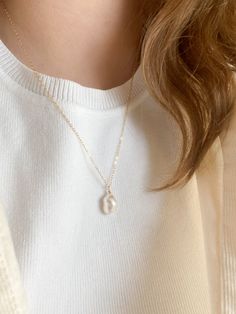 This necklace is 20 inches long. The perfect minimal necklace to wear with any outfit. The Pearl is unique and is cultured. The chain and other components are gold filled, a thick layer of gold over the base metal. This piece is safe to wear in water, but should stay away from any chemicals. Minimalist White Chain Necklace For Everyday, Single Strand Long Crystal Necklace, Minimalist Everyday Jewelry With Pearl Charm, White Everyday Necklaces With Delicate Chain, Everyday Adjustable White Necklace, Everyday Adjustable White Necklaces, White Jewelry With Adjustable Chain For Everyday, Everyday Adjustable Necklace With Pearl Charm, Adjustable Everyday Necklace With Pearl Charm