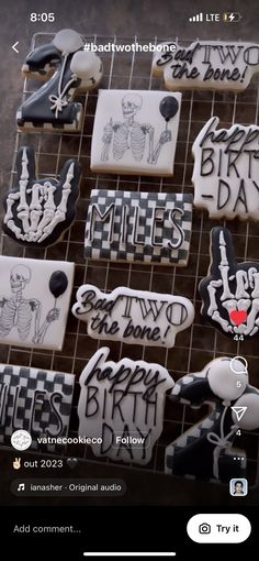 cookies decorated with black and white designs on a rack