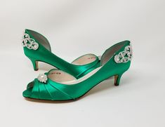 "Emerald Green wedding shoes designed with a sparkling crystal back design have a kitten heel which is perfect for your wedding day or any special occasion! These shoes have been dyed a beautiful Emerald Green, but is available in over 100 colors including white and ivory - or I can match your own swatch of color! Please pick a choice from the drop down menu and then leave me the exact color you would like in the note to seller portion of checkout. If you would like a different heel size (2 1/2 Green Rhinestone Heels For Wedding, Green Rhinestone Wedding Heels, Emerald Green Wedding Shoes, Green Bridal Shoes, Green Kitten Heels, Bridal Shoes Green, Emerald Green Heels, Dream Wedding Shoes, Royal Blue Heels