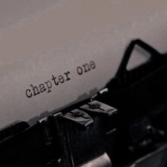 an old fashioned typewriter with the words, chapter one written on it