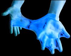 a pair of hands that are glowing blue