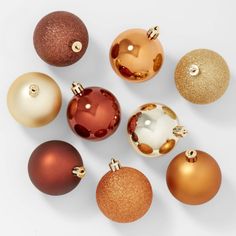 an assortment of christmas ornaments on a white background